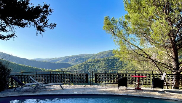 A pool area with a view of a mountainous landscape. - Stunning charming detached house with private heated pool (La Roque-Sainte-Marguerite)