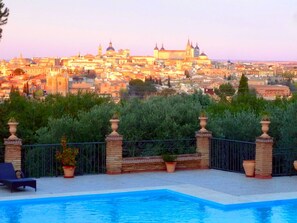 A poolside view with a cityscape in the background. - The Cigarral of the Incarnation (Toledo)