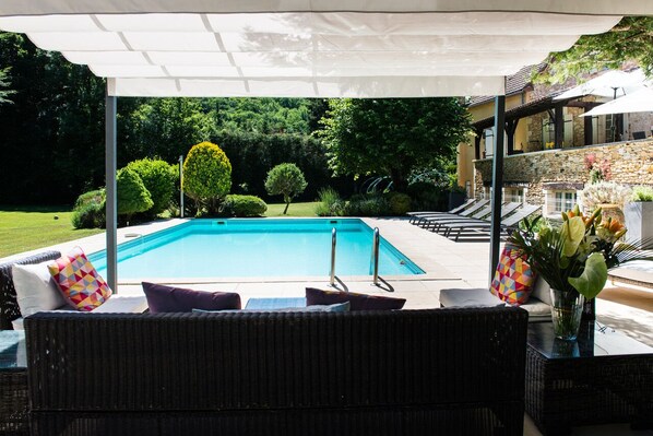 Outdoor pool, a heated pool, pool loungers