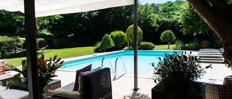 Outdoor pool, a heated pool, pool loungers