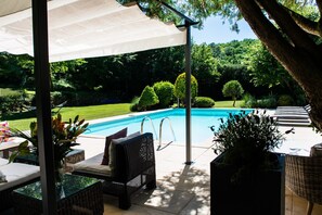 Outdoor pool, a heated pool, sun loungers