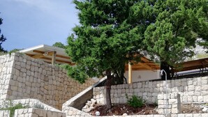 A stone staircase leading up to a wooden deck with a tree. - MAGICAL HOUSE " MARICA" WITH PRIVATE BEACH, PARADISE  FAR AWAY FROM STRESS LIFE (Klek)