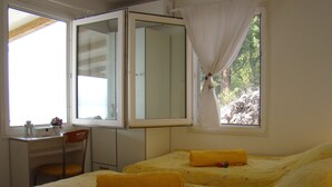 A room with two beds, a desk, and a chair. - MAGICAL HOUSE " MARICA" WITH PRIVATE BEACH, PARADISE  FAR AWAY FROM STRESS LIFE (Klek)