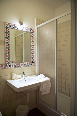 Bathtub, hair dryer, towels, soap