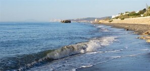 On the beach, sun loungers, beach towels