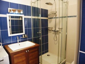 Shower, hair dryer, towels, toilet paper