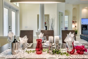 Enjoy dining in style with a beautifully set table and elegant decor.