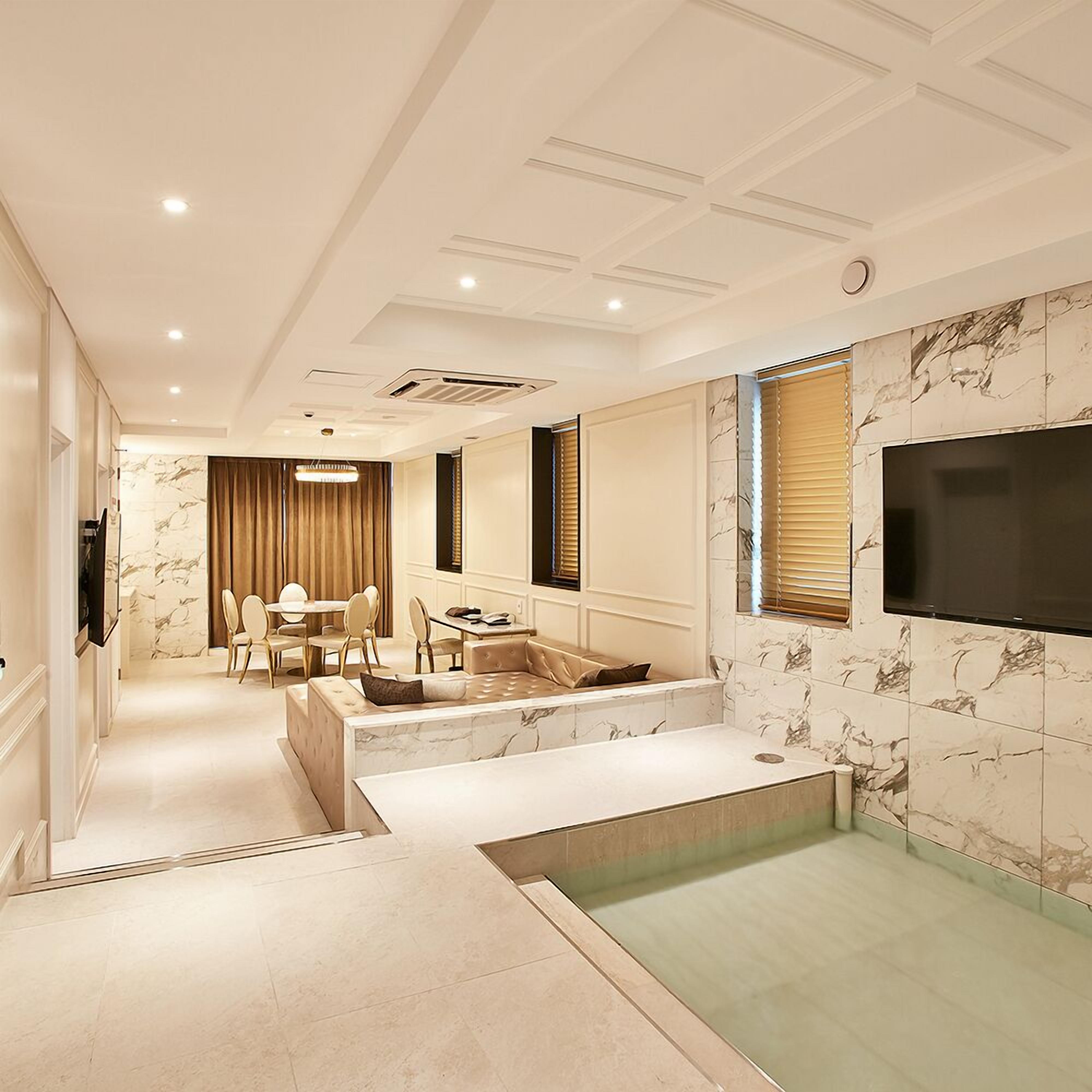 wanted suite | living area | flat-screen tv