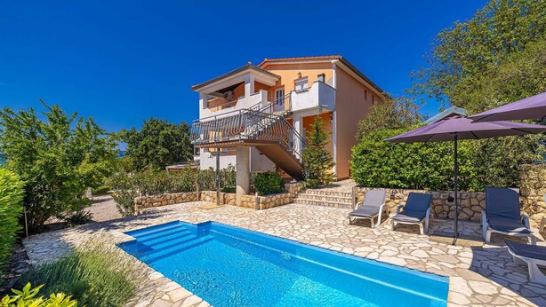 A two-story building with a swimming pool, outdoor seating, and a stone pathway. - Holiday house MICHAEL with shared pool and private jacuzzi (Pinezići)