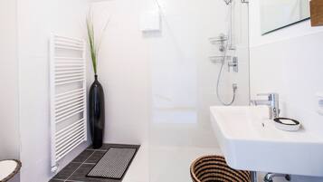 Bathtub, hair dryer, towels, soap