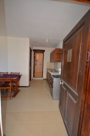 Departamento, 1 habitación | Cocineta privada | Refrigerador, parrilla de estufa y utensilios de cocina 