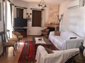 Villa | Living area | LCD TV, fireplace