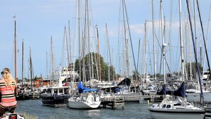 A marina with numerous sailboats docked. - “Markermeerlogies am See” Historic, unique, exclusive, and very modern (Bovenkarspel)