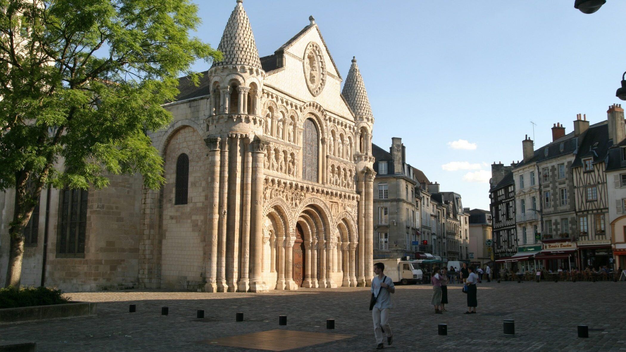 A historic cathedral with intricate stone carvings and multiple spires.