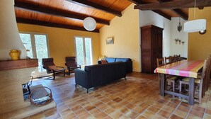 A spacious living area with a sofa, chairs, a dining table, and a kitchen area. - Villa sleeps 8 with superb pool   (La Tour-D'aigues)