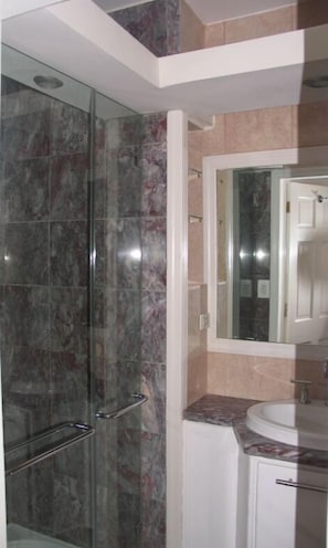 Shower, hair dryer, towels, toilet paper