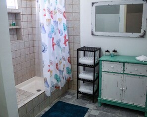 Combined shower/tub, hair dryer, towels, soap