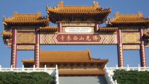 A traditional Chinese gate with ornate designs and inscriptions.