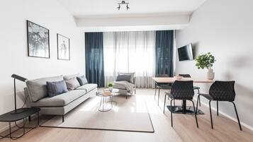 Apartment, 1 Bedroom | Desk, iron/ironing board, free WiFi, bed sheets