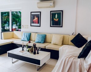 4-Bedroom Villa | Living area | Flat-screen TV