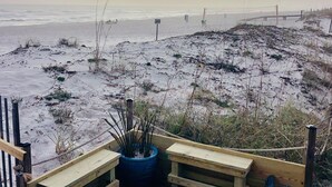 A wooden deck with benches overlooking a beach. - #404- 2 bed-1 bath sleeps 6- Fall beach getaway…& Winter Snowbirds! Book now! (Gulf Shores)