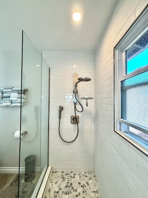 Shower, hair dryer, towels, soap