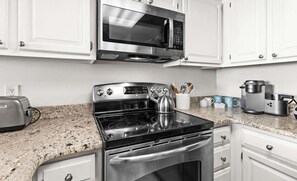 Coffee/tea maker, fridge, microwave, oven