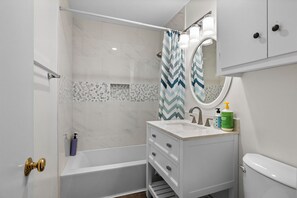 Combined shower/bathtub, hair dryer, towels, soap
