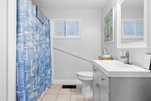 Combined shower/tub, hair dryer, towels, toilet paper