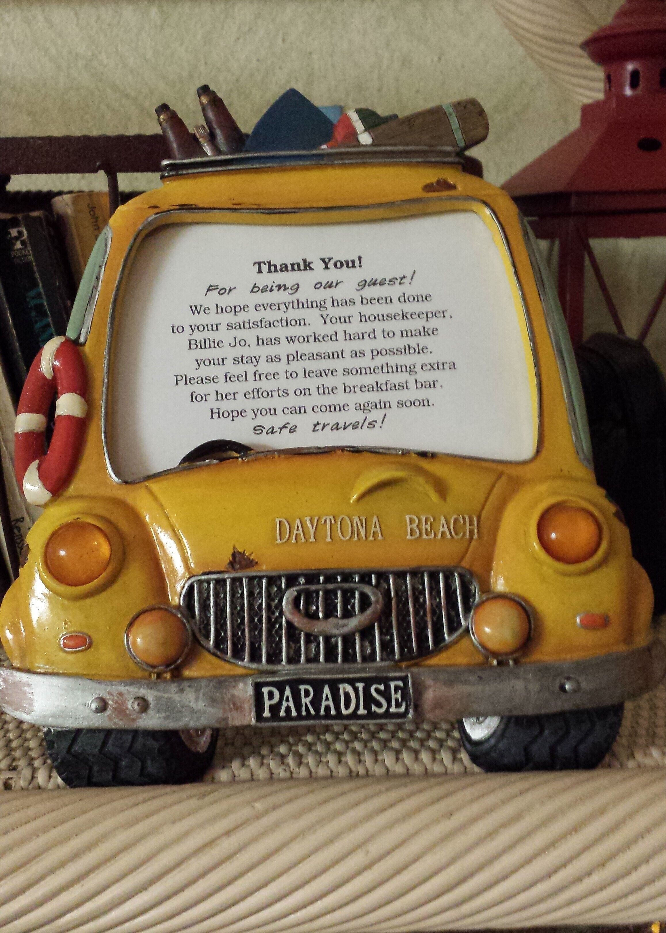 A yellow vehicle with a message thanking guests and mentioning a housekeeper named Billie Jo.