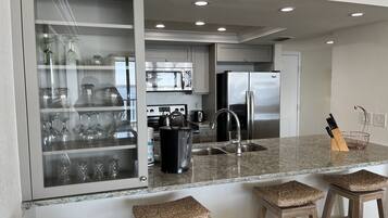 Coffee/tea maker, fridge, microwave, oven