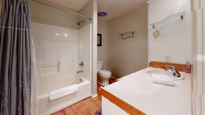 Combined shower/tub, hair dryer, towels, soap