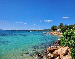 On the beach, sun loungers, beach towels