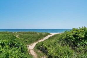 On the beach, sun loungers, beach towels