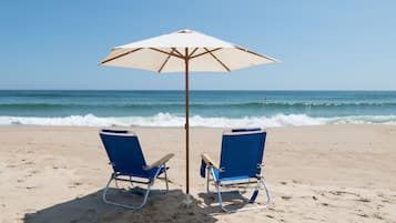 On the beach, sun-loungers, beach towels