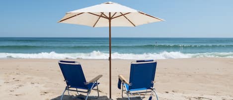 On the beach, sun-loungers, beach towels