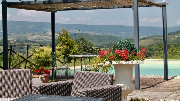 An outdoor seating area with wicker furniture, a pergola, and a view of a mountainous landscape. - Private Home & Private Pool  
Family Friendly/Welcome Dinner
IT055013C2DU035651 (Ficulle, Umbria)