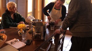 A kitchen with a chandelier, a stove, and a dining table with a vase of flowers. - Private Home & Private Pool  
Family Friendly/Welcome Dinner
IT055013C2DU035651 (Ficulle, Umbria)