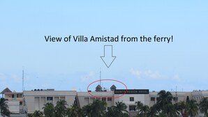 A view of Villa Amistad from the ferry, highlighting the Quinta Region Naval building. - Breathtaking 7 Bedroom Villa on the Ocean with a Infinity Private Pool (Isla Mujeres)