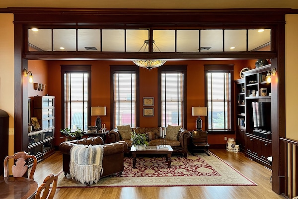 Living room -- with a smart TV and built in surround sound --overlooks Main St.