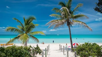 On the beach, sun loungers, beach towels