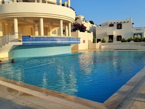 Outdoor pool, pool umbrellas, pool loungers