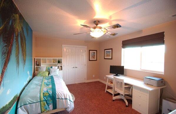 A bedroom with a bed, desk, chair, ceiling fan, and window. - Tacit Shadow - Single/Queen Sleeps 3 (Parowan)