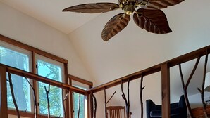 A spacious kitchen with a central island, wooden ceiling fan, and large windows providing natural light. - Beautiful lake house getaway (Pine Bush)