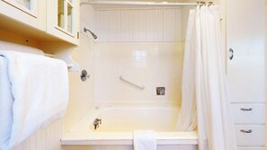 Combined shower/bathtub, hair dryer, towels, soap - OCEAN FRONT: ONCE UPON A TIDE:  Seaside Vacation Homes, Inc Managed  (Seaside)