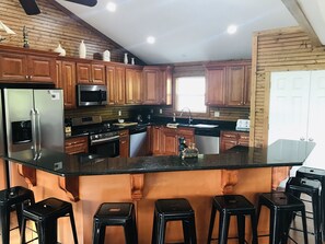 Fridge, microwave, oven, stovetop - Pirates Cove 9 Bed/9 Bath,  large hot tub,  private fire pit, double dock  (La Follette)