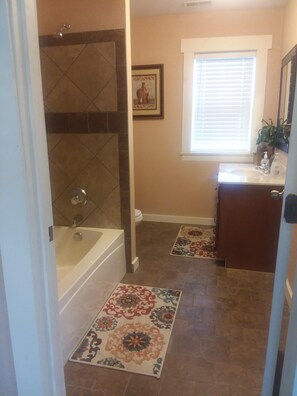 Combined shower/tub, hair dryer, towels, soap