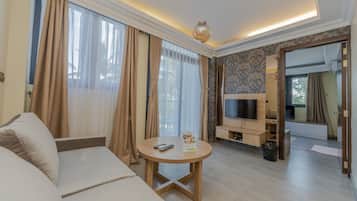 Suite, Non Smoking, Ocean View | Living area | 36-inch flat-screen TV with satellite channels, TV, iPod dock