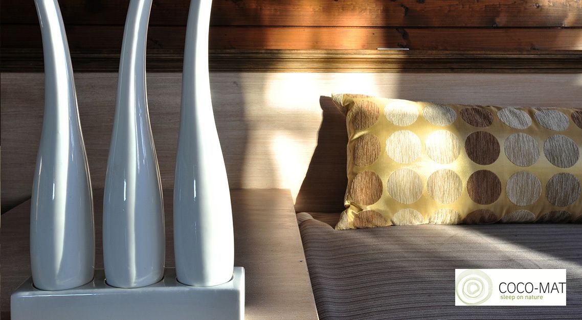 A modern interior with a sofa and decorative vases.