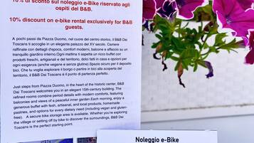 A brochure for B&B DaiToscans with a 10% discount on e-bike rental for guests.